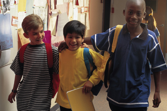 three boys smiling