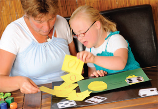 woman playing cards with a child